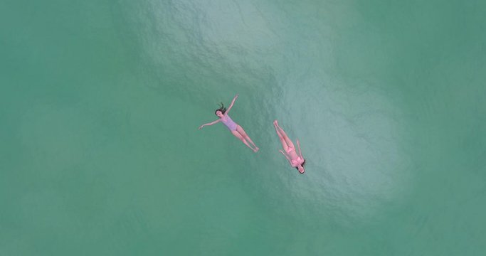 Dead Sea, Israel, Girls with lowest place,tree and island on the earth