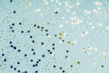 Trendy mint background with golden stars. The concept of celebrations, the Day of St. Valentine, Christmas, New Year, holiday, birthday, etc.