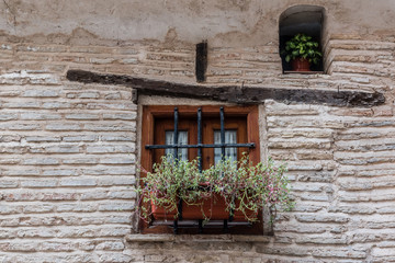 wooden window on brick wall