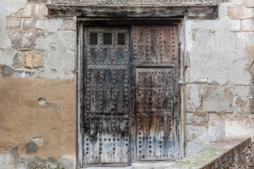 Wooden Door on clay wall