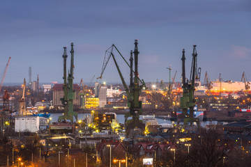 Cranes of the shipyard in Gdansk at dawn, Poland