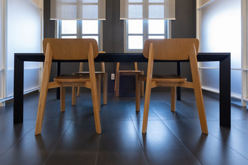 Modern wooden table and chairs in conference room meeting room Interior of modern open space office decoration