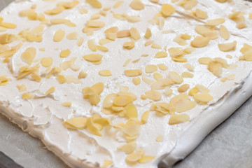 Cooking meringue roll on a baking sheet