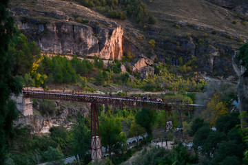 Tourists walking on a bridge, Saint Paul Bridge, Barrio De Tiradores, Cuenca, Cuenca Province, Castilla La Mancha, Spain