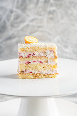 piece of cake with cream on a white plate