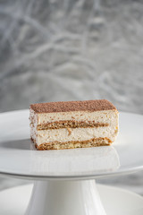 piece of cake with cream on a white plate