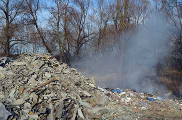 Nature near Ukrainian capital. Trash burning. Air pollution. Environmental contamination. Illegal junk dump. Near Kiev, Ukraine
