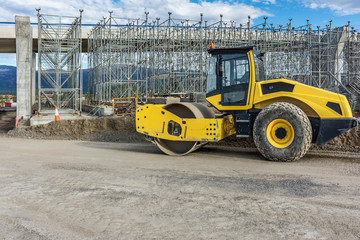 Construction of a highway and an overpass with heavy machineryConstruction of a highway and an overpass with heavy machinery