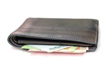 brown leather wallet with thai banknotes on white background.