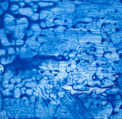 Creative art texture or design as an abstract background - blue blurs, paint smears, splats, dots, & watery brushstrokes.