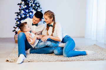 mom dad and son decorate Christmas tree gifts new year tree winter holiday Garland