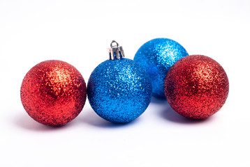 Simple blue and red Christmas balls on white background,
