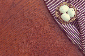 Easter eggs on wooden board, easter holiday concept. Copyspace for text.