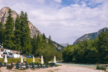 Nature view summer day time. The incredibly beautiful river of turquoise color, Dolomites...