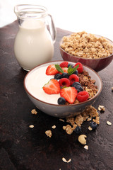 Tasty homemade granola served on table. Healthy breakfast with a bowl of oatmeal with banana, blueberries, strawberries and healthy food for Breakfast