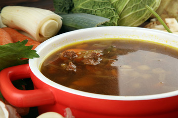 Meat stew with beef, potato, carrot, onion, spices, green peas. Slow cooked meat stew, bowl. Hot autumn or winter dish. Closeup. Comfort food.