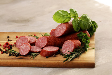 sausage slices, smoked meat product (tasty snack salami) menu concept. food background with cracow sausages