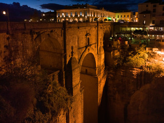 Illuminated city on top of Puente Nuevo Bridge, Ronda, Malaga Province, Spain