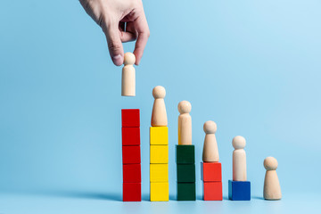 Hand choosing people standing out from crowd, successful team leadership, cooperation management concept