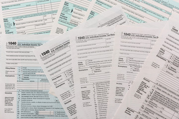 Obraz premium many 1040 tax form. Tax concept.