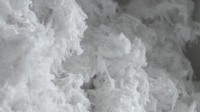 Closeup of cotton inside machine textile industry