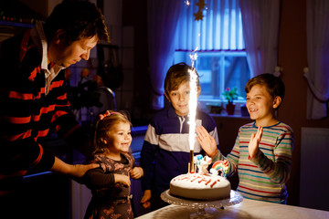 Adorable little toddler girl celebrating third birthday. Baby child, two kids boys brothers and...