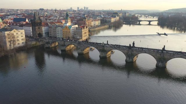 Aerial view of Charles Bridge at sunset light in desember in Prague, Czech Republic