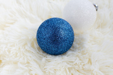 Christmas tree toy on the Christmas tree white and blue on a white plaid