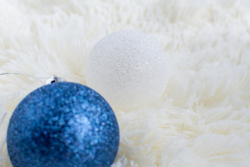 Christmas tree toy on the Christmas tree white and blue on a white plaid