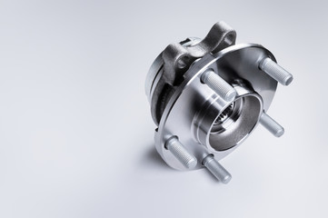 New Wheel hub assembly with bearing. This is part of the car suspension on a gray background with a...