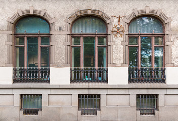 Several windows in a row on the facade of the urban historic building front view, Vyborg, Leningrad Oblast, Russia