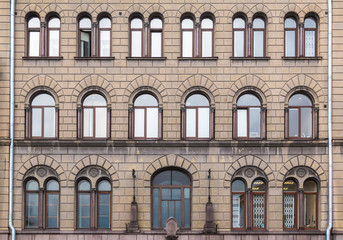 Many windows in a row on the facade of the urban historic building front view, Vyborg, Leningrad Oblast, Russia