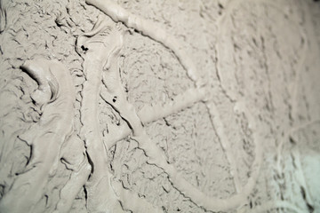 Plastering of concrete walls texture with cement spraying machine