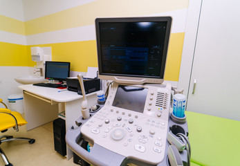 Ultrasound device for testing sonogram. Clinic interior. Sonography. Health tests concept. Closeup