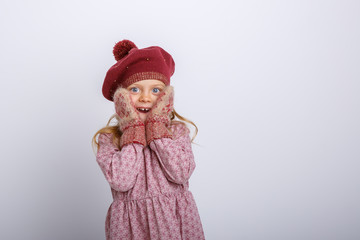 little girl surprised on gray background