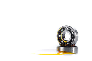 Closed up used ball bearing isolated on white background with copy space. Pouring automotive engine...