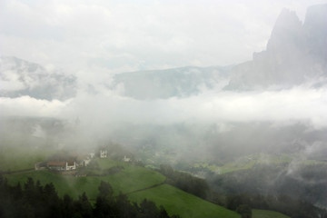 White clouds on the slopes of the Dolomites