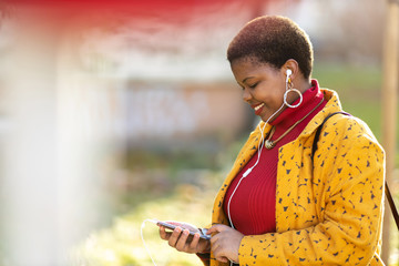 Young woman with smartphone in an urban city area