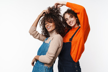 Optimistic two multiracial girls friends