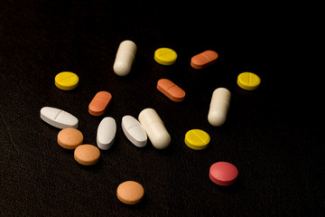 pills on black background