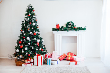 Fototapeta na wymiar Christmas tree Garland lights new year holiday gifts white home decor
