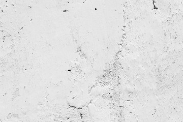 Texture of a concrete wall with cracks and scratches which can be used as a background