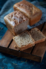 Sourdough bread. Sliced rye bread on a dark background. Healthy eating concept.