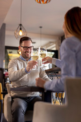 Couple making a toast with glasses of wine