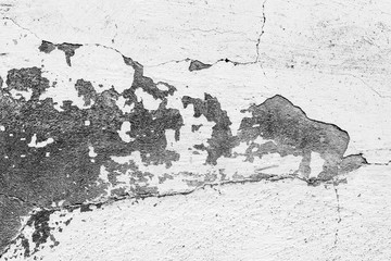 Texture of a concrete wall with cracks and scratches which can be used as a background