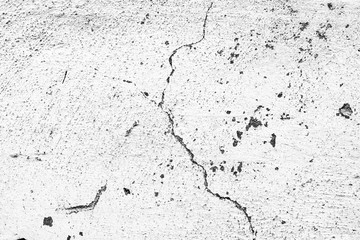 Texture of a concrete wall with cracks and scratches which can be used as a background