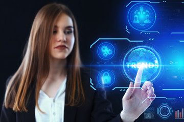 Business, Technology, Internet and network concept. Young businessman working on a virtual screen of the future and sees the inscription: Trends
