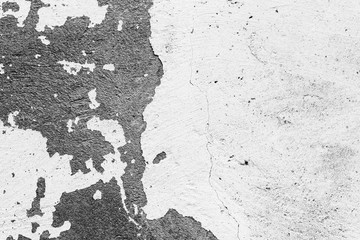 Texture of a concrete wall with cracks and scratches which can be used as a background