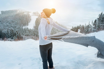 Happy woman traveler on the snowy of mountain look on the nice view
