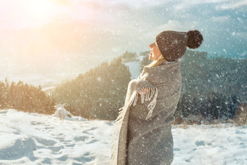 Happy woman traveler on the snowy of mountain look on the nice view